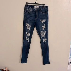 Dark blue distressed skinny jeans